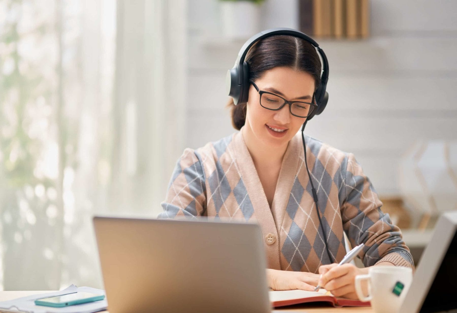 Woman working on a laptop cybersecurity training
